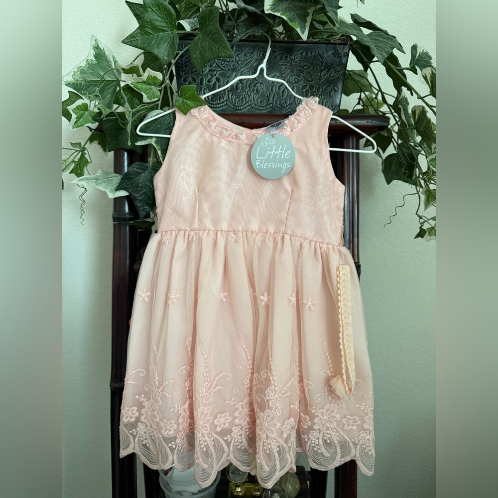 Girl’s peach dress, 12 months + headpiece. Brand is Little Blessings.